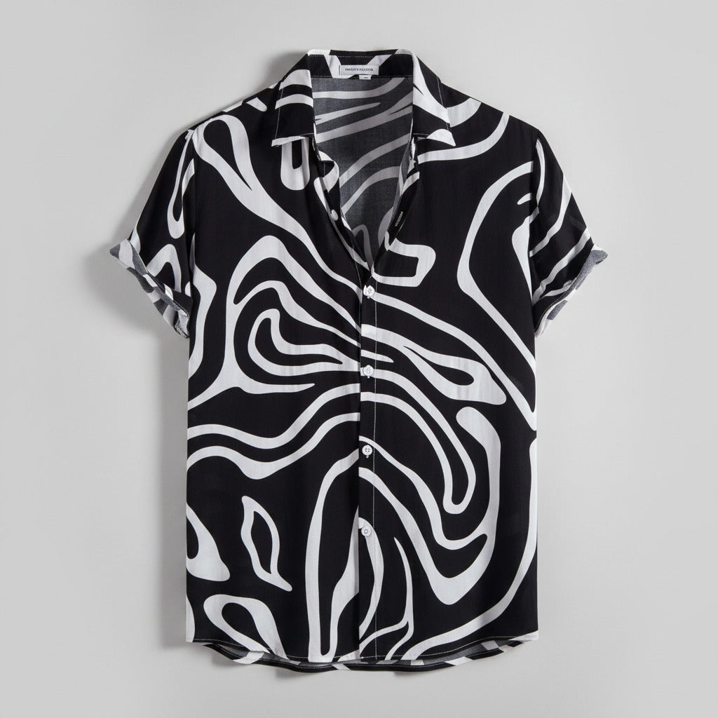 Black and white patterned shirt on a hanger with a white background