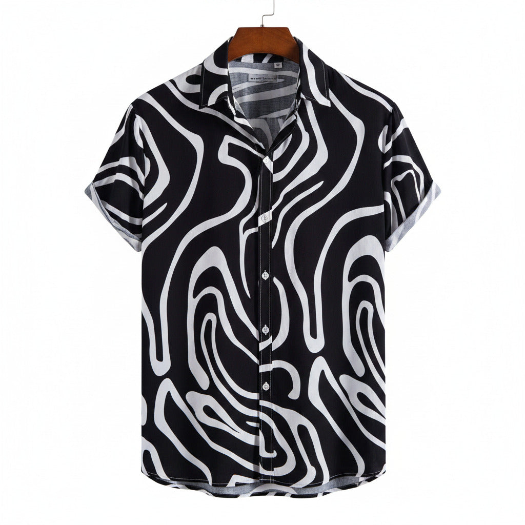 Black and white patterned shirt on a hanger with a white background