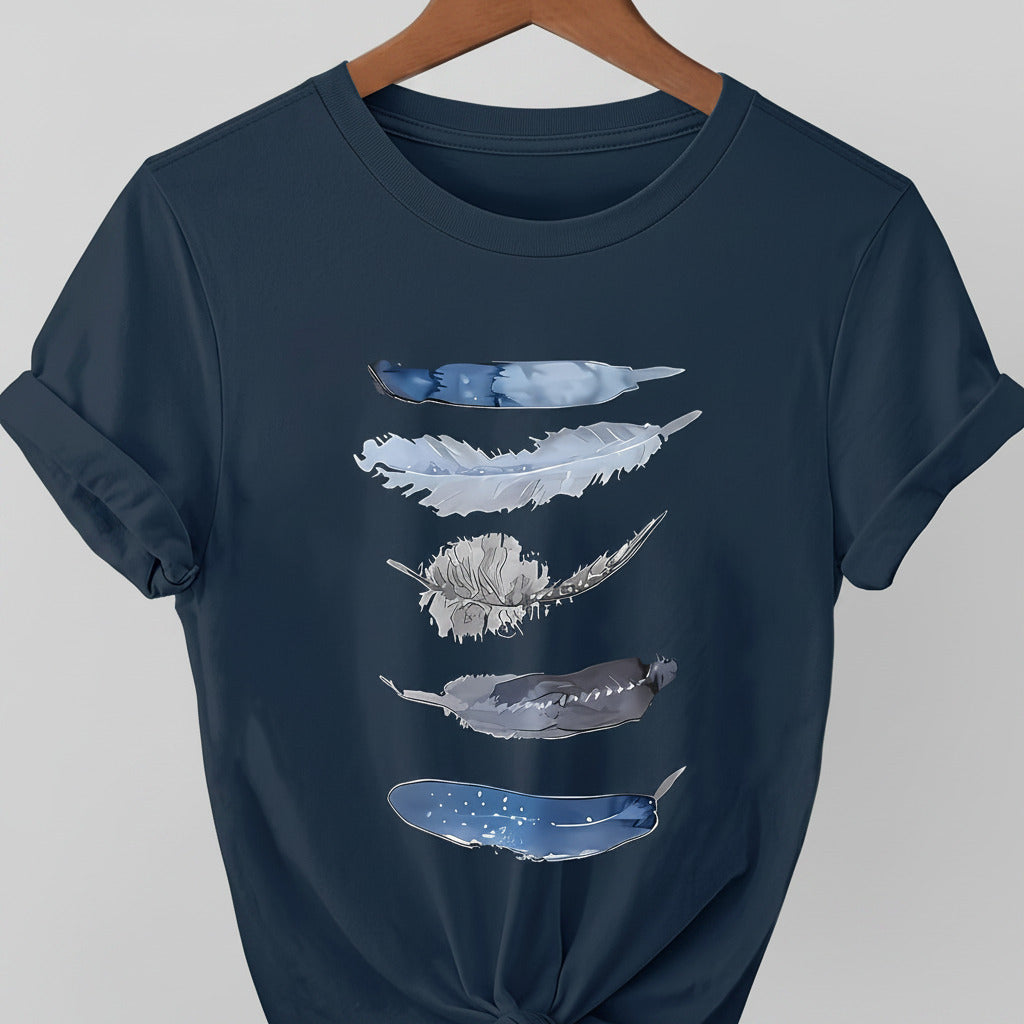 Navy blue t-shirt with feather designs on a hanger against a denim background