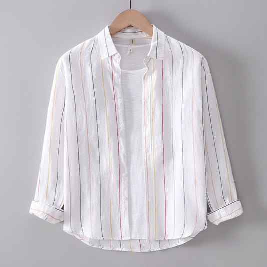 White striped shirt on a wooden hanger against a gray background