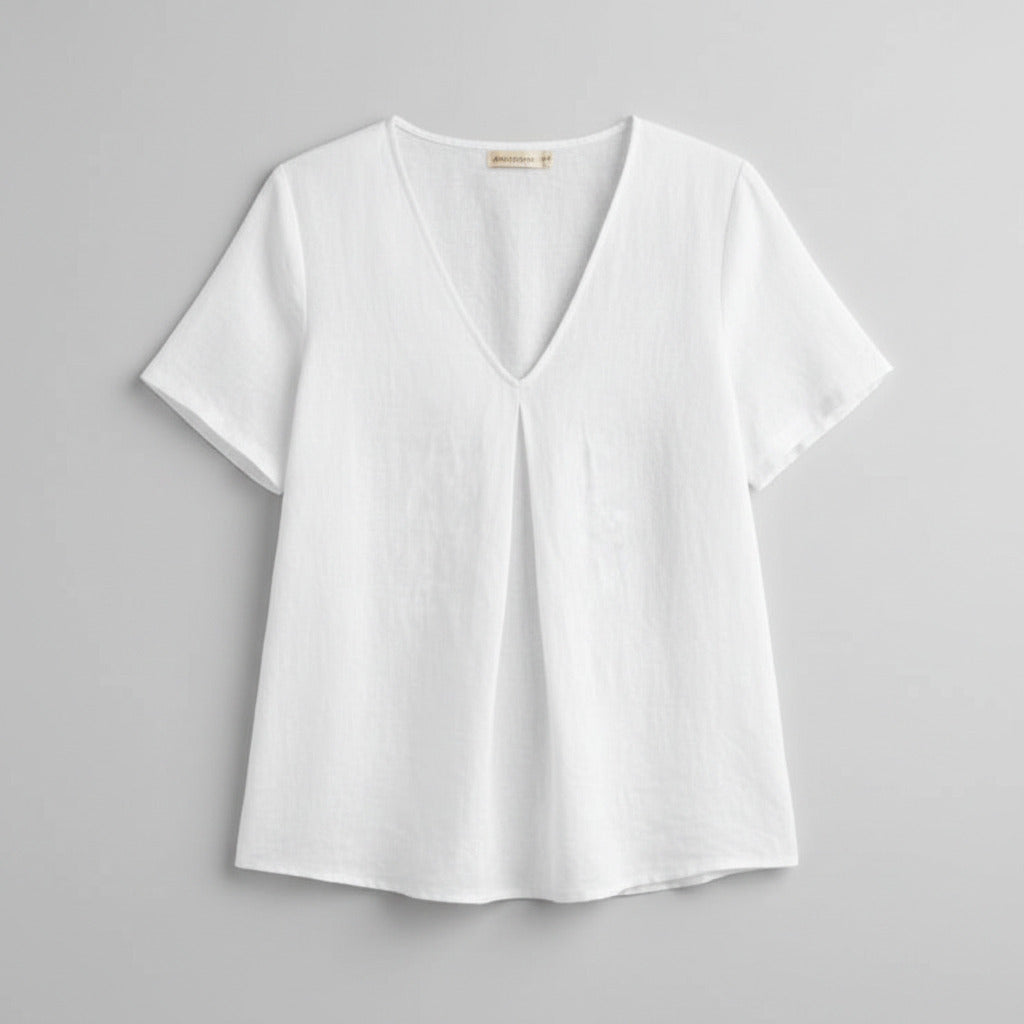 Woman wearing a white linen top with color options displayed.