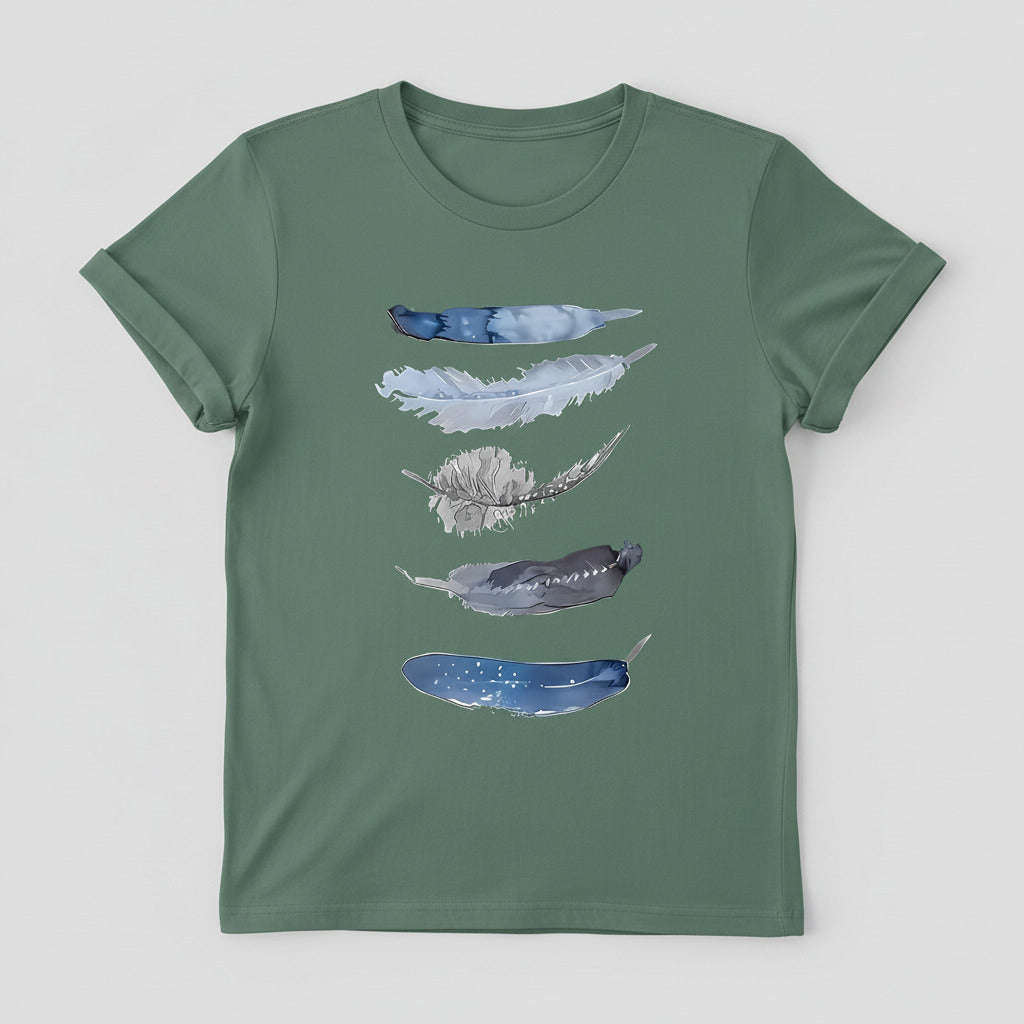 Green t-shirt with feather design on a hanger against a denim background
